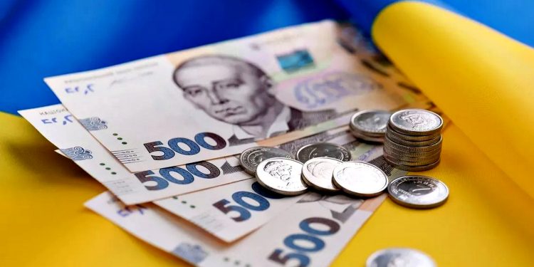 Гривні та прапор України.