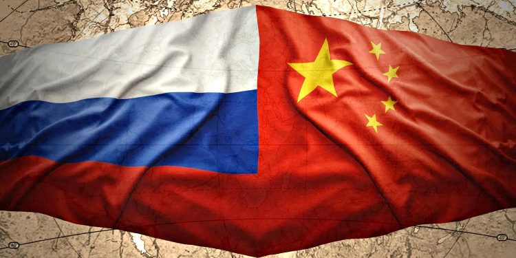 Прапори РФ та КНР.